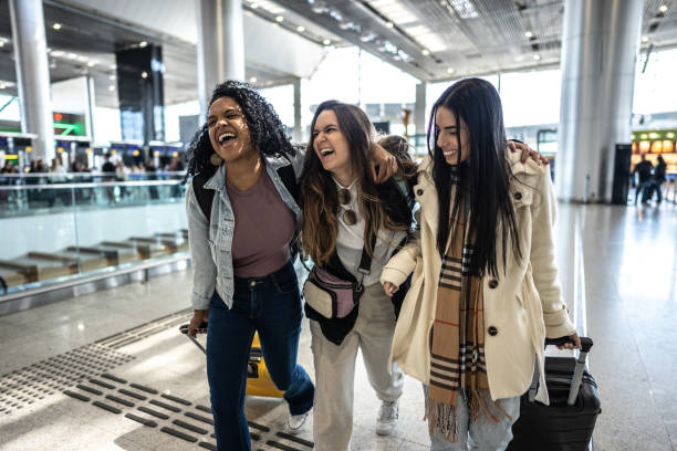 istock Friends walking while talk at the airport 1502938527
