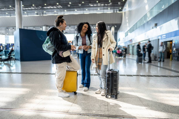 istock Friends talking at the airport 1502938653