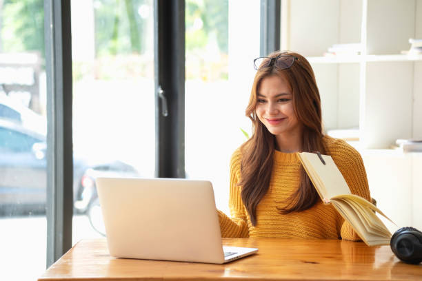 istock Happy latin girl college student watching distance online learning class, remote university webinar or having talk on laptop video call and use notebook to virtual meeting seminar at home or campus 1502938752