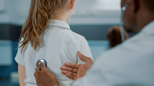 istock African american medic consulting little kid with stethoscope 1502940598