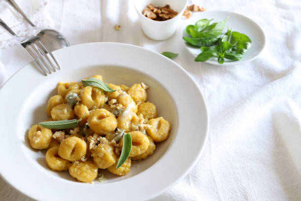 istock Gnocchi with gorgonzola cream and walnuts. 1502945211