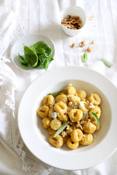 istock Gnocchi with gorgonzola cream and walnuts. 1502945219