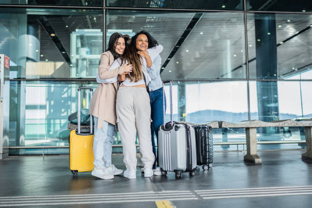 istock Friends embracing at the airport 1502945698