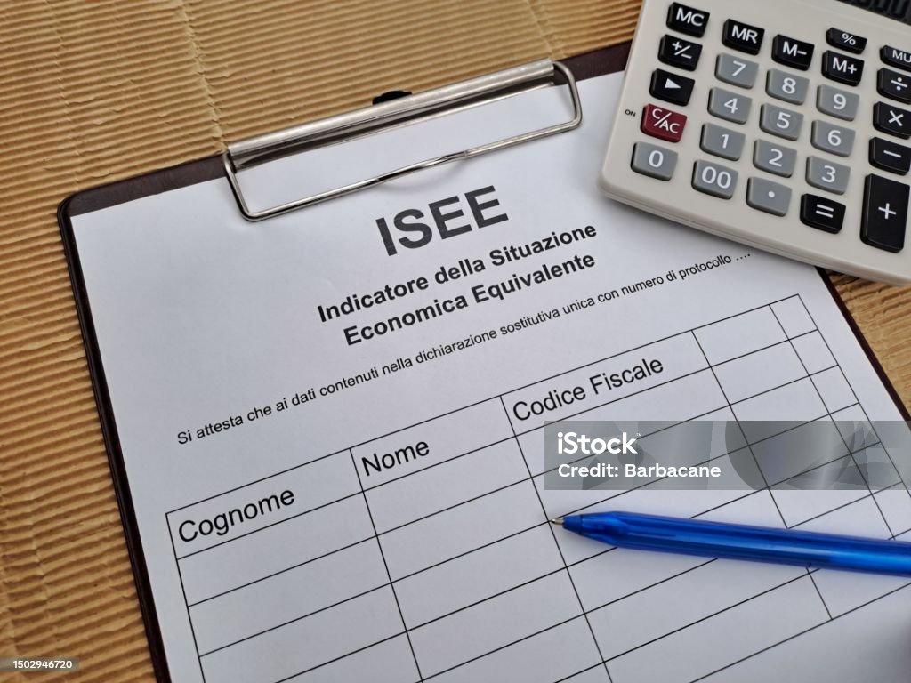 Equivalent Economic Situation Indicator Form Modello ISEE Equivalent Economic Situation Indicator Form Modello ISEE. On the table pen and calculator. Bank - Financial Building Stock Photo