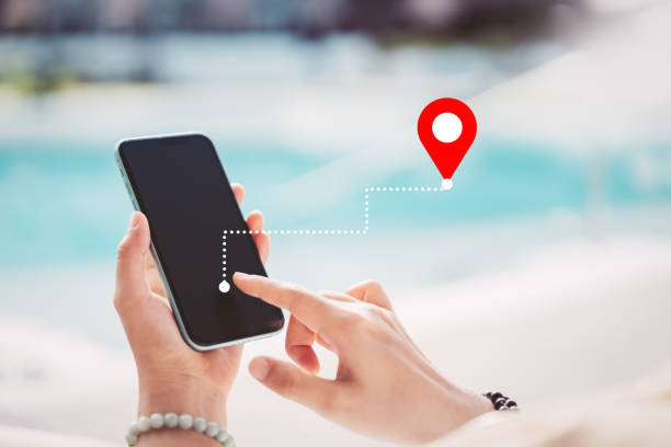 istock Woman hand using smart phone with navigator location point at tropical sunset beach abstract background. Technology interenet and travel adventure concept. Vintage tone filter effect color style. 1502946799