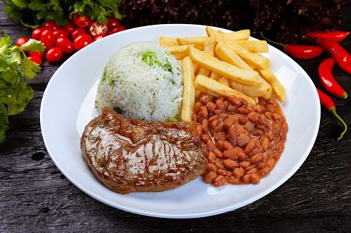 Rice, beans, french fries and meat