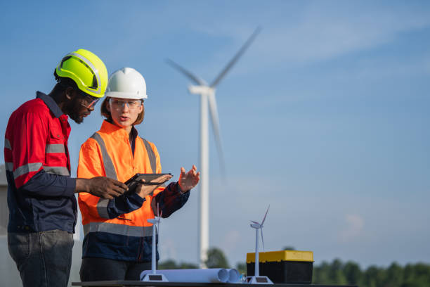 istock Team of engineer meeting about wind turbine project. 1502953910