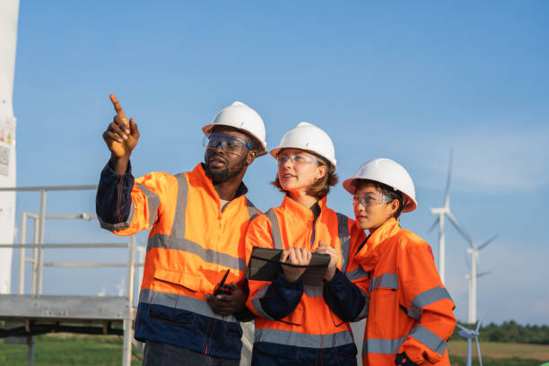 istock Team of engineer meeting about wind turbine project. 1502954481