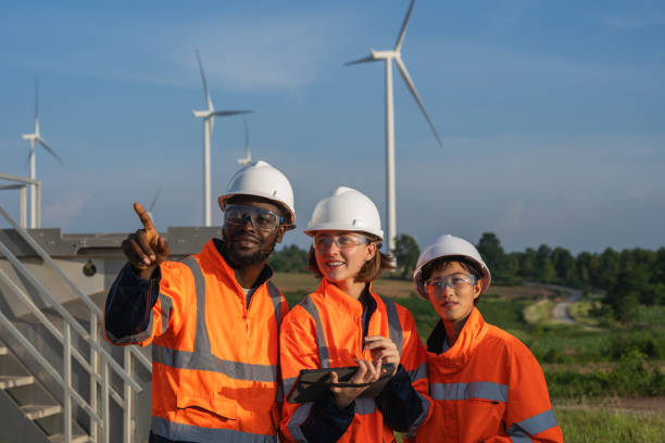 istock Team of engineer meeting about wind turbine project. 1502954489