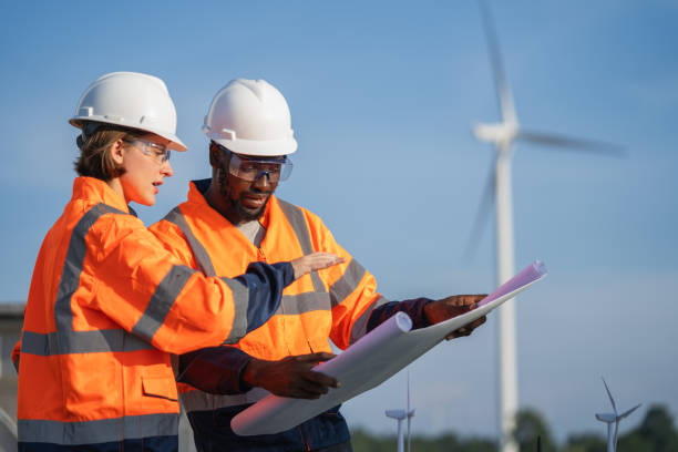 istock Team of engineer meeting about wind turbine project. 1502954503