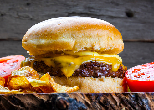 Delicious hamburger with meat bun and vegetables