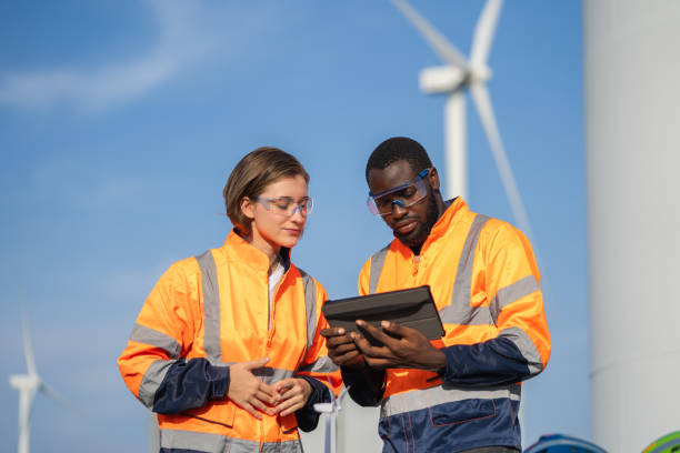 istock Team of engineer meeting about wind turbine project. 1502954530