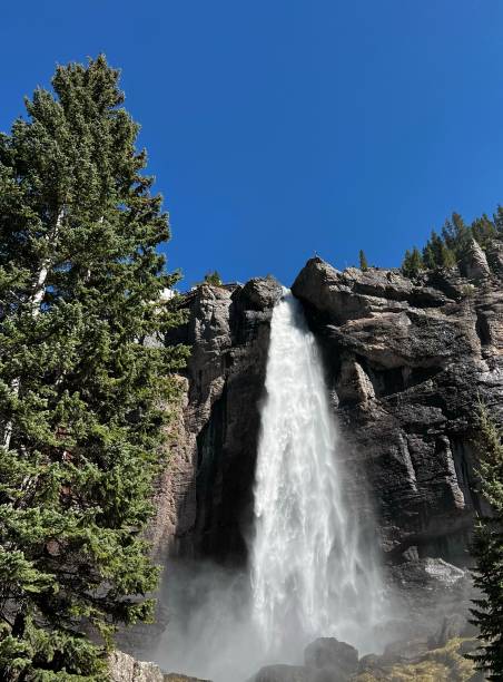 istock Majestic hill landscape, with a rushing waterfall cascading down 1502955455