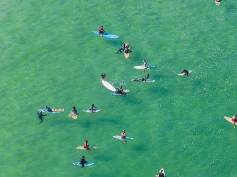 Aerial view of Rio de Janeiro, surfers in the water, Ipanema beach. Atlantic Ocean waves. 06-07-2023. Brazil