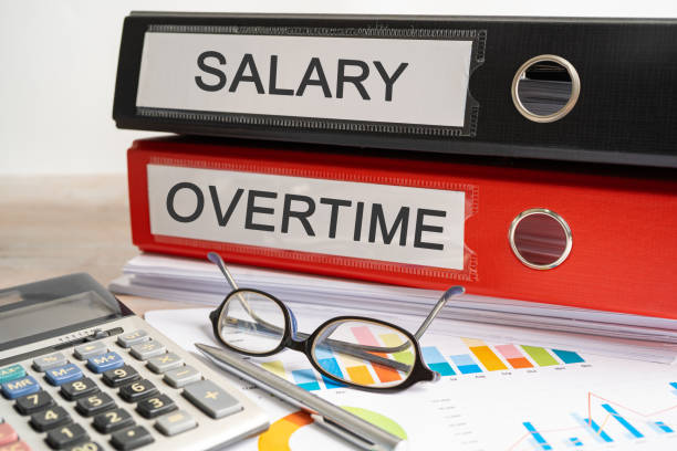 istock Salary, Overtime. Binder data finance report business with graph analysis in office. 1502956884