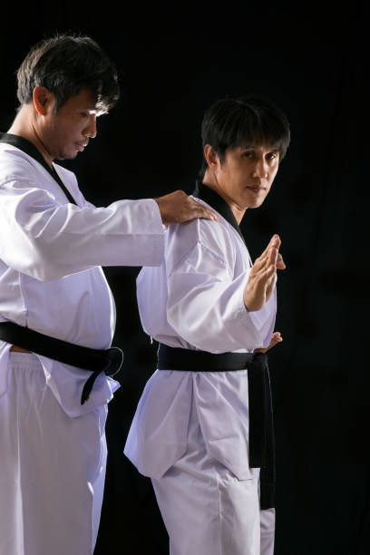 istock Taekwondo Training Two-Man Poses checking on black background 1502956935
