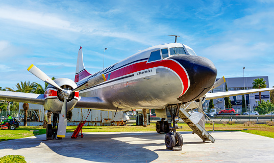 View of vintage airplane displayed outdoors in Malaga Aviation Museum, a popular tourist attraction free to visit.
