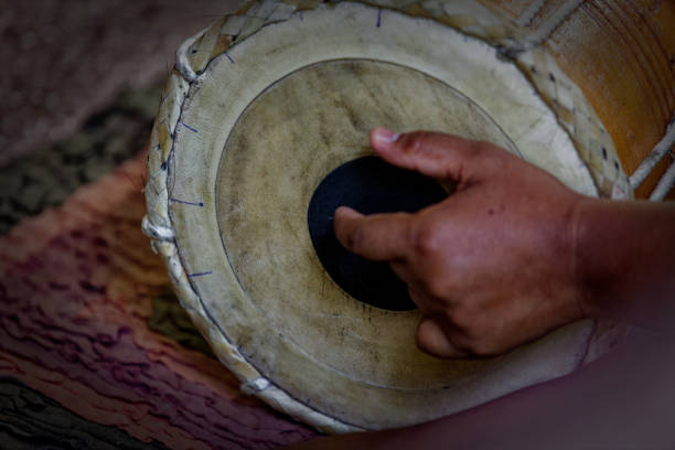 istock Grown man playing dolak drum, traditional percussion instrument, player, drummer 1502957072