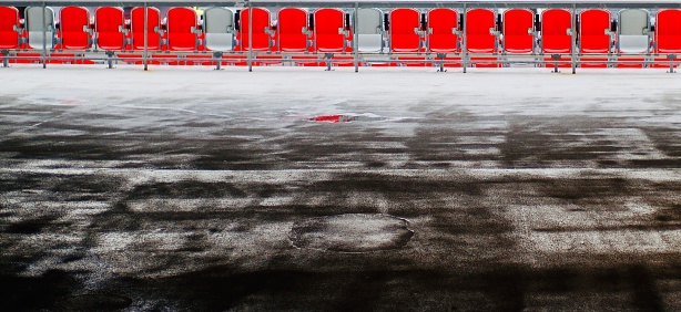 Abstract red stadium seats in the morning.