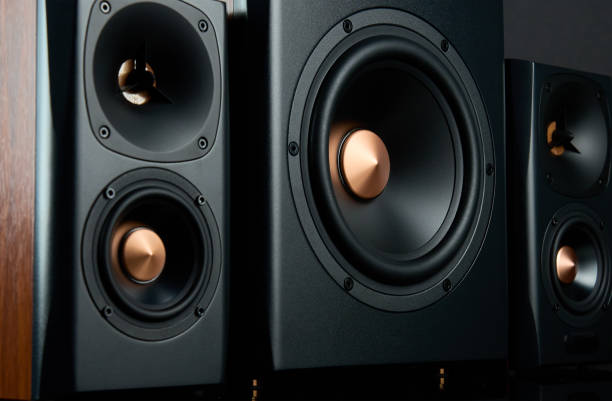istock Sound audio system with two satellites and subwoofer on dark background. 1502963730