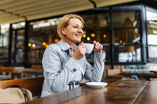 Happy Business Woman Drinking Coffee In The Restaurant