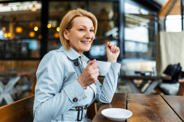 istock Smiling Businesswoman Drinking Coffee In The Restaurant 1502966184