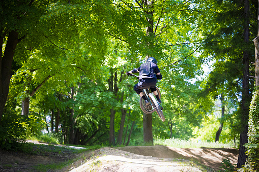 forest jumpline with the mountain bike in the bikepark.