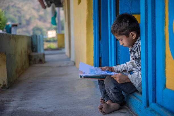 istock Cute Indian Village Child Studying At Home 1502967563