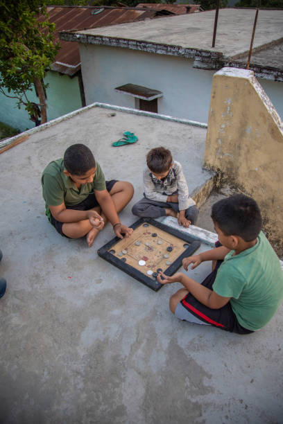 istock Indian village school kids playing carrom board 1502967717