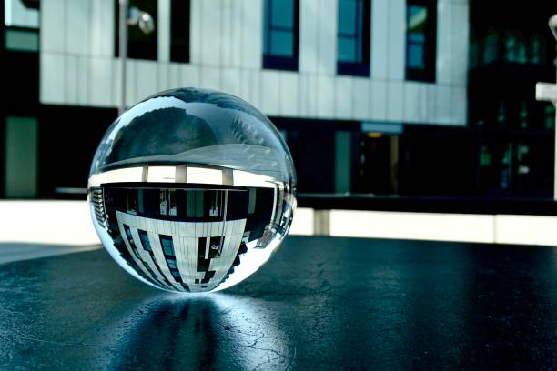 istock Crystal ball on bench against modern buildings 1502967781