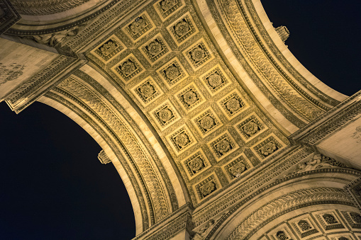 Arc du Triomphe, Paris, France. Ceiling embossed floral pattern decoration. Night photography.