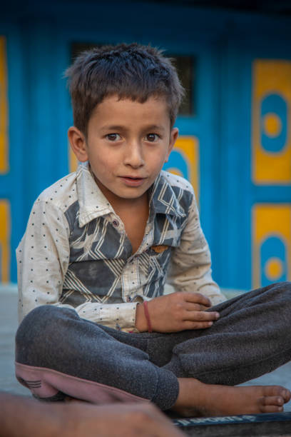 istock Young Indian boy kid practicing or playing Carrom board at his village home 1502969164