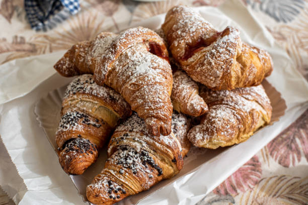 tray of fresh brioche, filled with various jams and creams - fotografia de stock