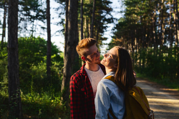 Young couple having fun and embrace in nature