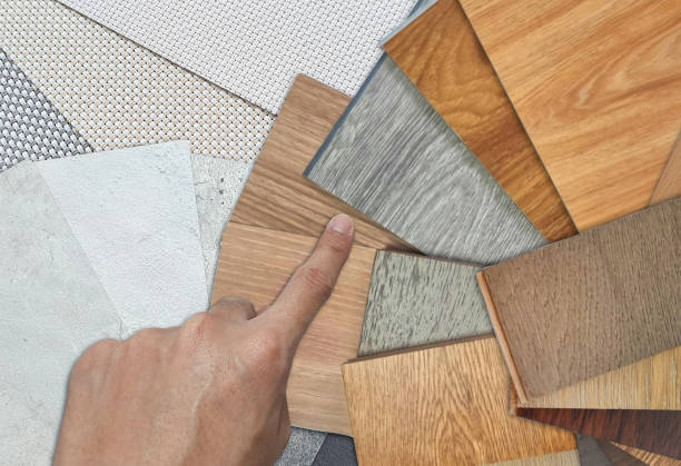 istock architect chooses wooden interior material samples swatch contains vinyl flooring tiles, engineering flooring tiles, laminated, veneer placed on concrete laminated and roller blind fabric samples. 1502972095