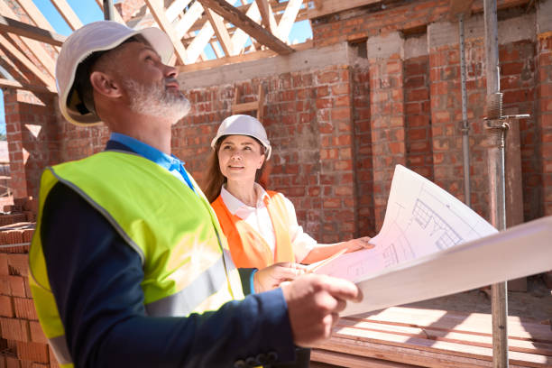 istock Building engineer asking for advice about roof beams of foreman 1502974736