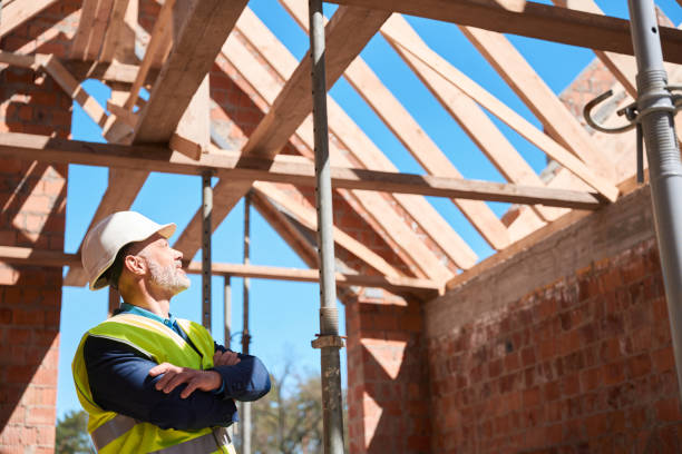 istock Male roofer contemplating about ceiling covering and attic design 1502974761