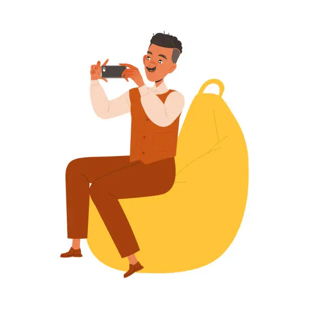 Vector illustration of Mustached Man Character Sitting on Beanbag Chair Filming with Smartphone Working in Coworking Space Vector Illustration