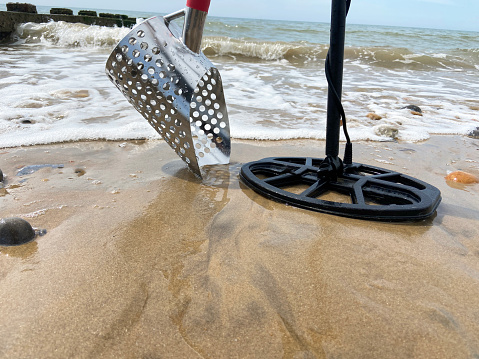 sand scoop metal detecting metal detector beach stock photo background with copy space
