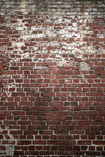 Textured background dark red wall with white painted color old brick. Design element, full frame