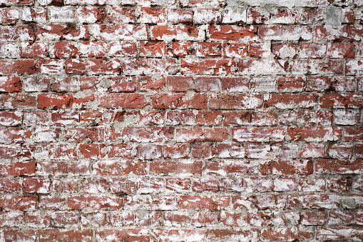 Textured grunge background red brick wall with white painted color old