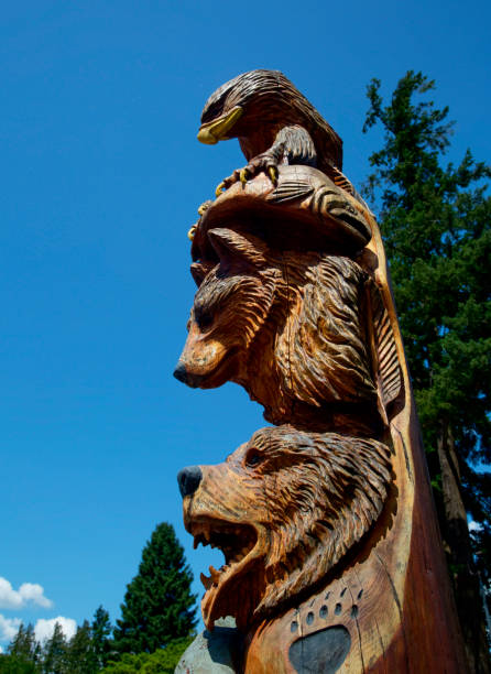 Totem Pole at Hope, British Columbia Totem pole at Hope, British Columbia visitor centre totem pole face stock pictures, royalty-free photos & images