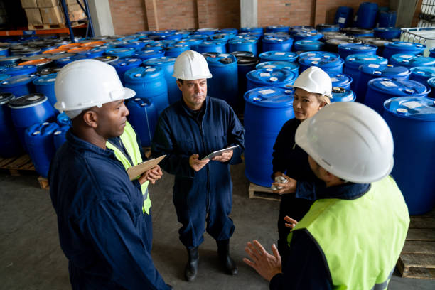 istock Foreman talking to a group of workers at a chemical plant 1502990366