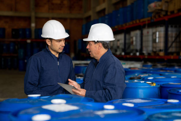istock Foreman talking to a worker at a chemical plant 1502990389