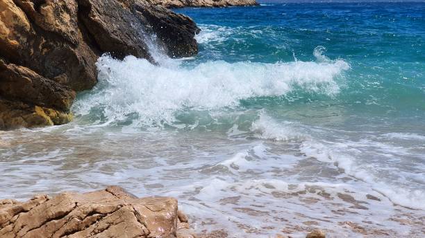 istock Look over the rocky beach with crushing waves 1502994738