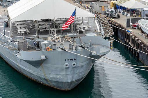 Navy frigate moored at naval dockyard.