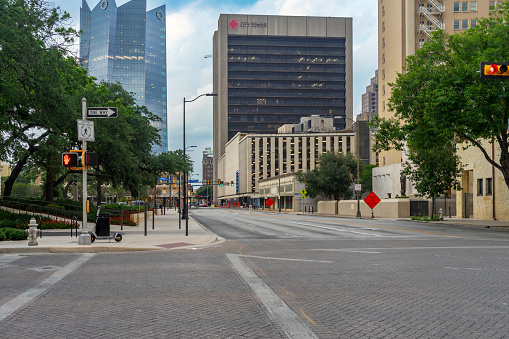 San Antonio, Texas, USA – May 8, 2023: City street view from Dolorosa Street and Flores Street in downtown San Antonio, Texas.