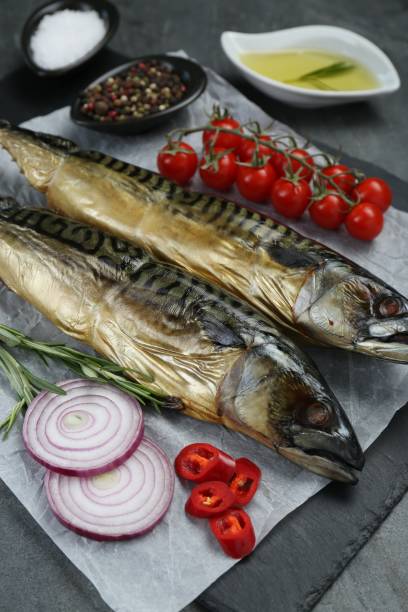 istock Delicious smoked mackerels and products on grey table, closeup 1503012536