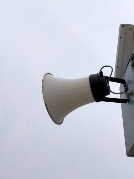istock loudspeaker on top of a mast, gray sky background, copy space 1503017300