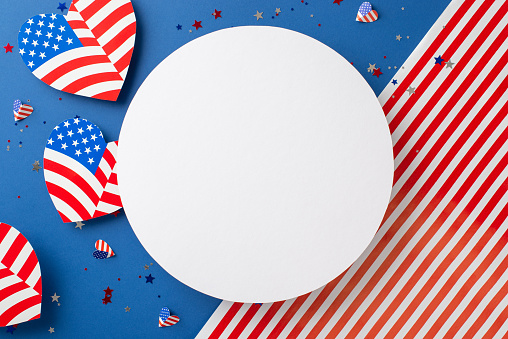 Celebrating freedom and independence. Top view harmonious display of symbolic decoration: hearts featuring American flag motif, confetti, national flag backdrop with circle, inviting text or promo use
